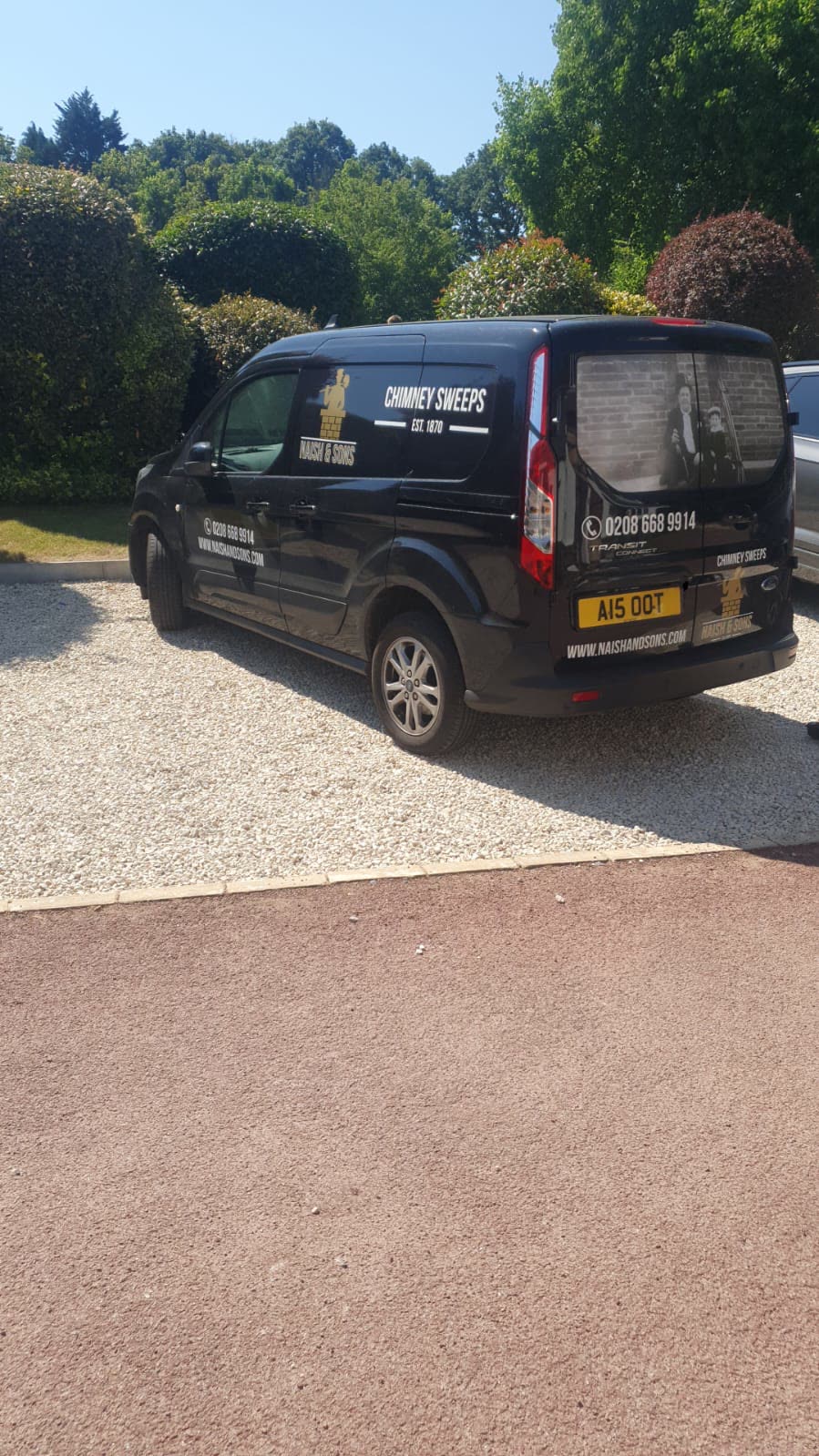 The rear of the Naish & Sons van with the family photograph in the window